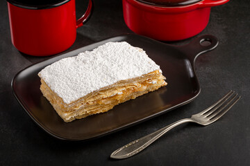 Mille feuille dessert on the plate.