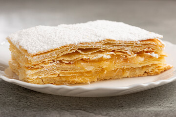 Mille feuille dessert on the plate.