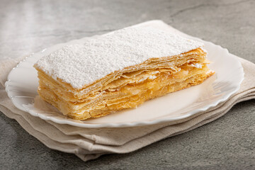 Mille feuille dessert on the plate.