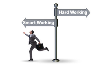 Businessman at the crossroads on working smart or hard