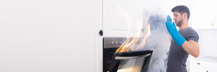 Man Looking At Fire Coming Out From Oven