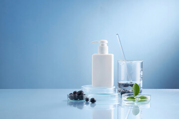 Front view of blueberry extract decorated with transparent podium and glassware cosmetic jar in blue background 