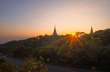 Twilight Moments sunset or sunrise Above the sacred pagoda at Doi Inthanon National Park, Chiang Mai, Thailand.
