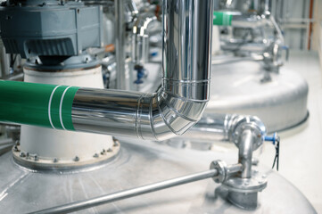 Complicated pipeline system in spacious workshop of plant