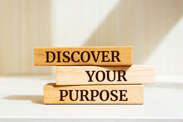 Wooden blocks with words 'discover your purpose'. 