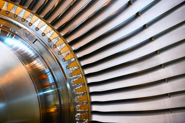 Rotor with blades of powerful steam turbine in workshop