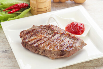 Grilled rib-eye steak beef meat