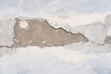 house broken. concrete crack. Water damage building interior. large crack white concrete wall