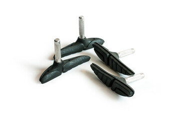 Bicycle brake pads for cantilever brake system, bicycle spare parts, on a white background.