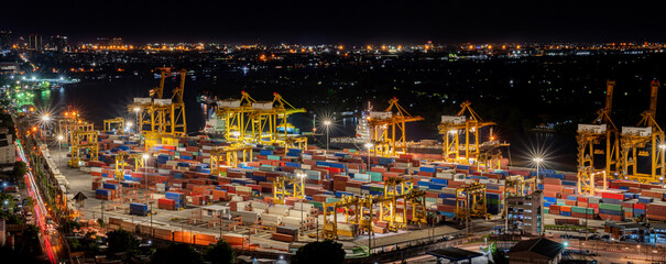 Night view of landscape container shipping  yard in the city. Import and export product. Manufacturing transportation and global business concept.