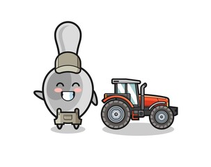the spoon farmer mascot standing beside a tractor