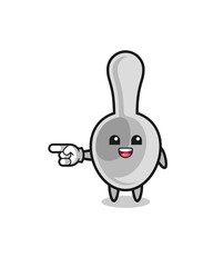 spoon cartoon with pointing left gesture