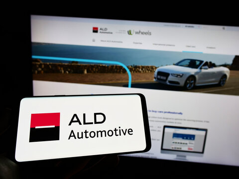 Stuttgart, Germany - 06-12-2022: Person holding cellphone with logo of French company TEMSYS S.A. (ALD Automotive) on screen in front of business webpage. Focus on phone display.