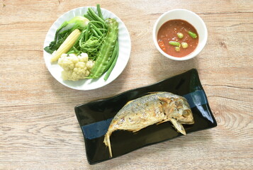 fried mackerel and spicy shrimp chili paste sauce eat couple with boiled vegetable on plate