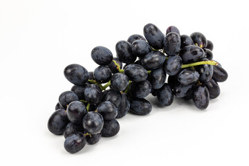 Black Grapes isolated in white background; water drops; studio lighting; macro detailing, negative space for copy