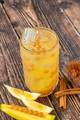 Fruity Bubble Tea in glass cup on dark background