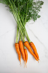 Top view of bunch of organic carrots roots food