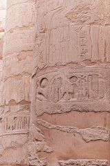 Real ancient Egyptian hieroglyphics engraved in a stone pillar at Karnak Temple in Luxor Egypt