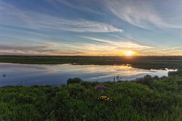 Fototapeta na wymiar Sunset on a beautiful marsh lake