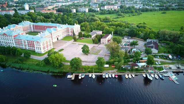 Aerial View of Jelgava City Panorama LLU Palace in Latvia, Zemgale. Largest Baroque Style Castle in Baltics on the Lielupe River Bank.  Aerial Jelgava City Sunset View. 