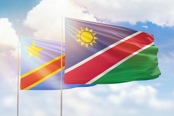 Sunny blue sky and flags of namibia and dr congo