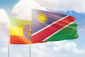 Sunny blue sky and flags of namibia and ethiopia