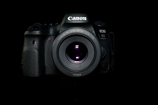 Canon EOS 6D Mark II camera on black background