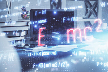 Desktop computer background and formula hologram writing. Double exposure. Education concept.