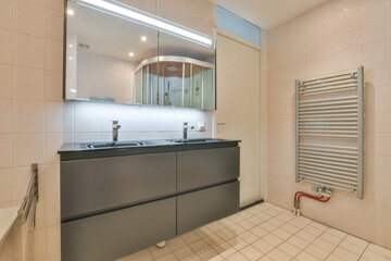 Interior of contemporary bathroom with shower, bathtub, toilet and sink in minimal style in flat