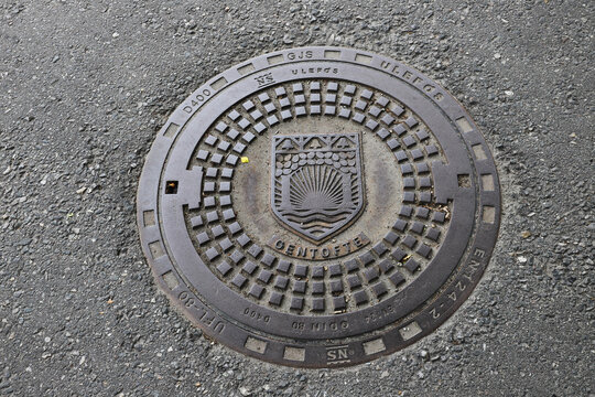 Hellereup, Denmark - June 14, 2022: Close-up view of a manhole withe Gentofte municipality coat of arms.