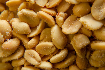 Close up of fried, peeled and salted peanuts.
