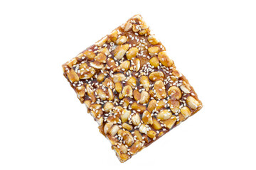 Peanut  mixed with sesame cereal bar, crispy crackers, Thai traditional snack that made from grains on white background. 
Shaped as a square bar, the taste is sweet and crispy from caramelized sugar.