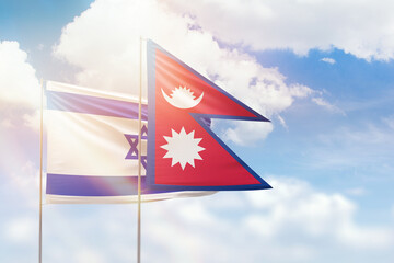 Sunny blue sky and flags of nepal and israel