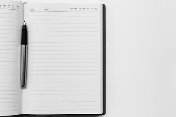 Pen on Notebook Isolated on the White Background