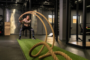 Rope warehouse fitness green man grass training gym muscular young, for strong strength from physical from healthy activity, person muscle. Cross ground holding,