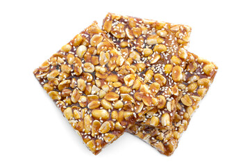 Peanut  mixed with sesame cereal bars, crispy crackers, Thai traditional snack that made from grains on white background. 
Shaped as a square bar, the taste is sweet and crispy from caramelized sugar.