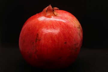 pomegranate on black background