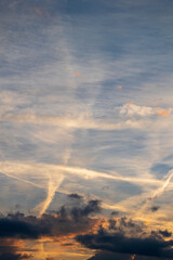 Naklejka na ściany i meble Beautiful sky for backgrounds with clouds in sunset with condensation stripes 