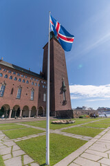 The Town City Hall saluting official visit from Norway with flag a sunny summer day in Stockholm