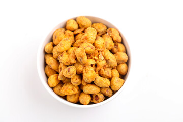 Roasted coated peanuts on white background. Delicious snack peanut.