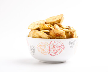 banana chips in bowl on white background.