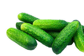 green cucumbers on a white background. ripe gherkins on a table. fresh vegetables on a light texture. the concept of growing cucumbers