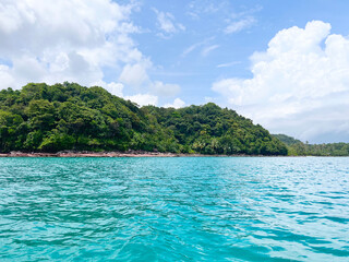 mountains and clear blue sea.
