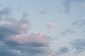 Beautiful sunset sky. Sky background. Gradient color. Dramatic blue and orange, colorful clouds at twilight time.