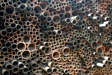 close up of a lot of pottery tubes
