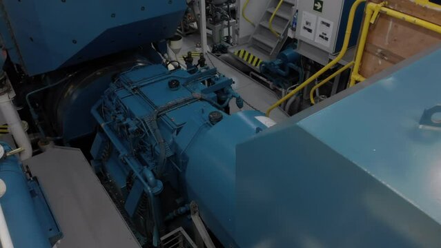 Gear and flywheel of propulsion in engine room of ship