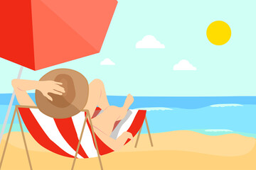 Woman in bikini and hat lying on a sun lounger sunbathing in front of the sea and protected by an umbrella