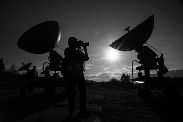 Naklejka premium Satellite dishes on summit at sun day