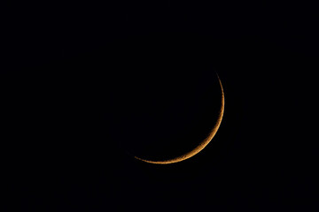 The crescent moon in the night in June over Germany