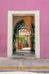 A beautiful doorway in Oaxaca, Mexico with pink wall, street photography